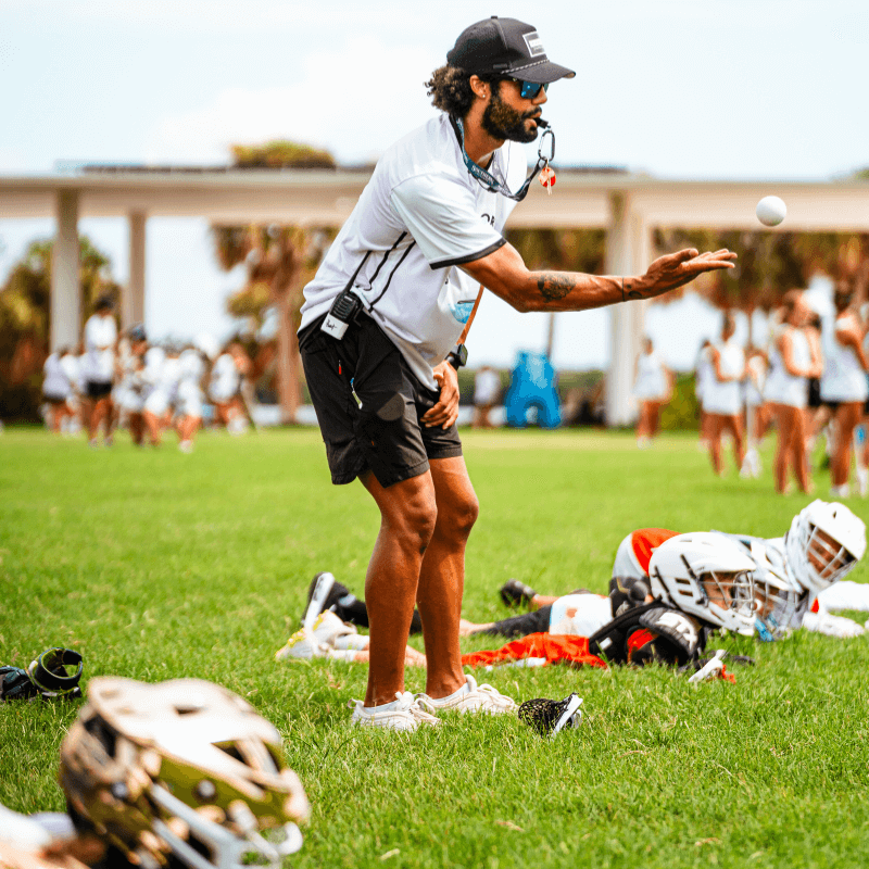 Coach at Signature Sports Camps providing instruction to youth athletes