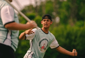Boys lacrosse coach providing one-on-one training at Signature Sports Camps.