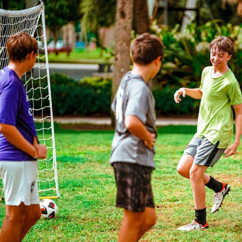 Boys engaged during a soccer scrimmage at signature sports camps