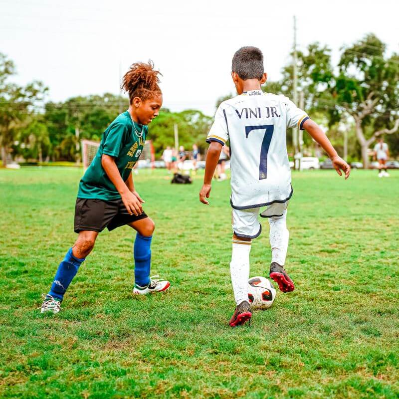 Two youth soccer boys practicing positional training at signature soccer camp