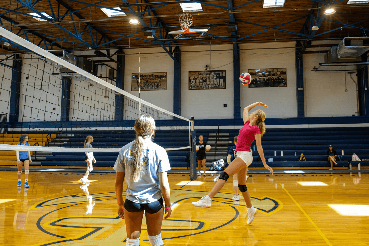 Girl hitting volleyball during practice at Signature Sports Camps