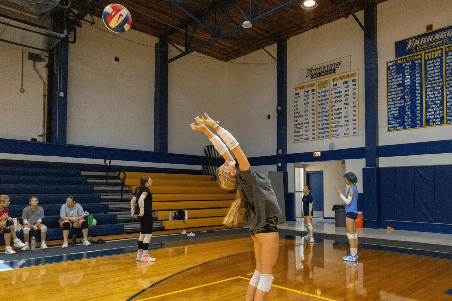 Girl practicing indoor volleyball techniques at Signature Sports Camps