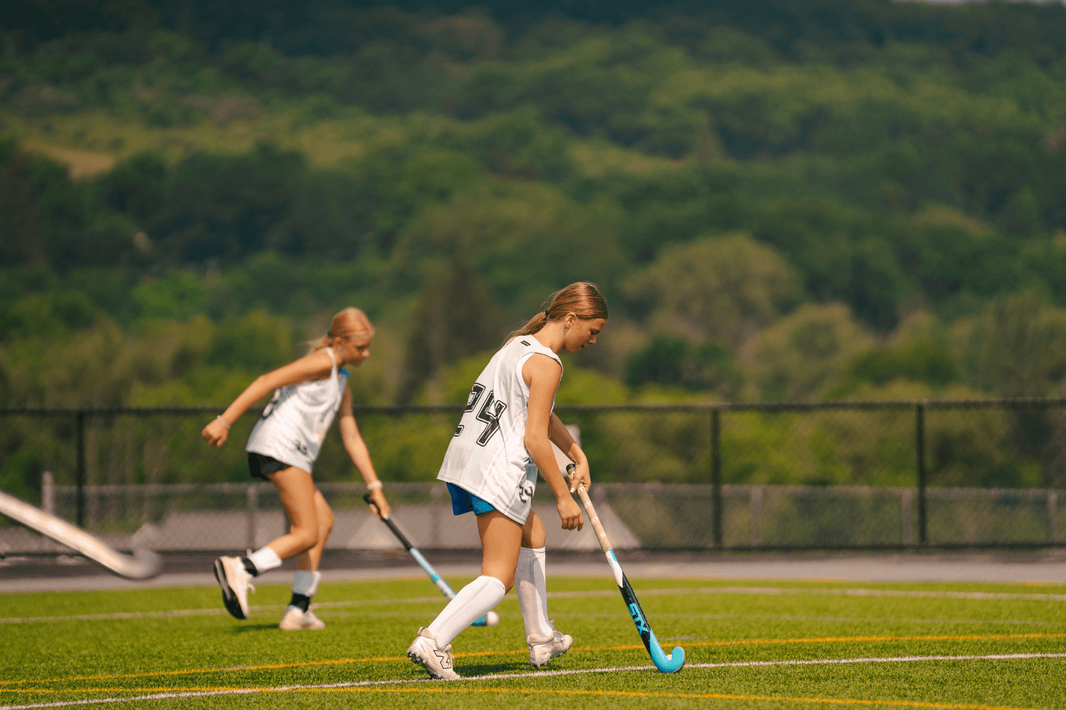 Girls during field hockey practice at overnight sports camp