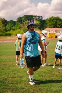 Great Youth Sports Coach ready to lead drills on the field.