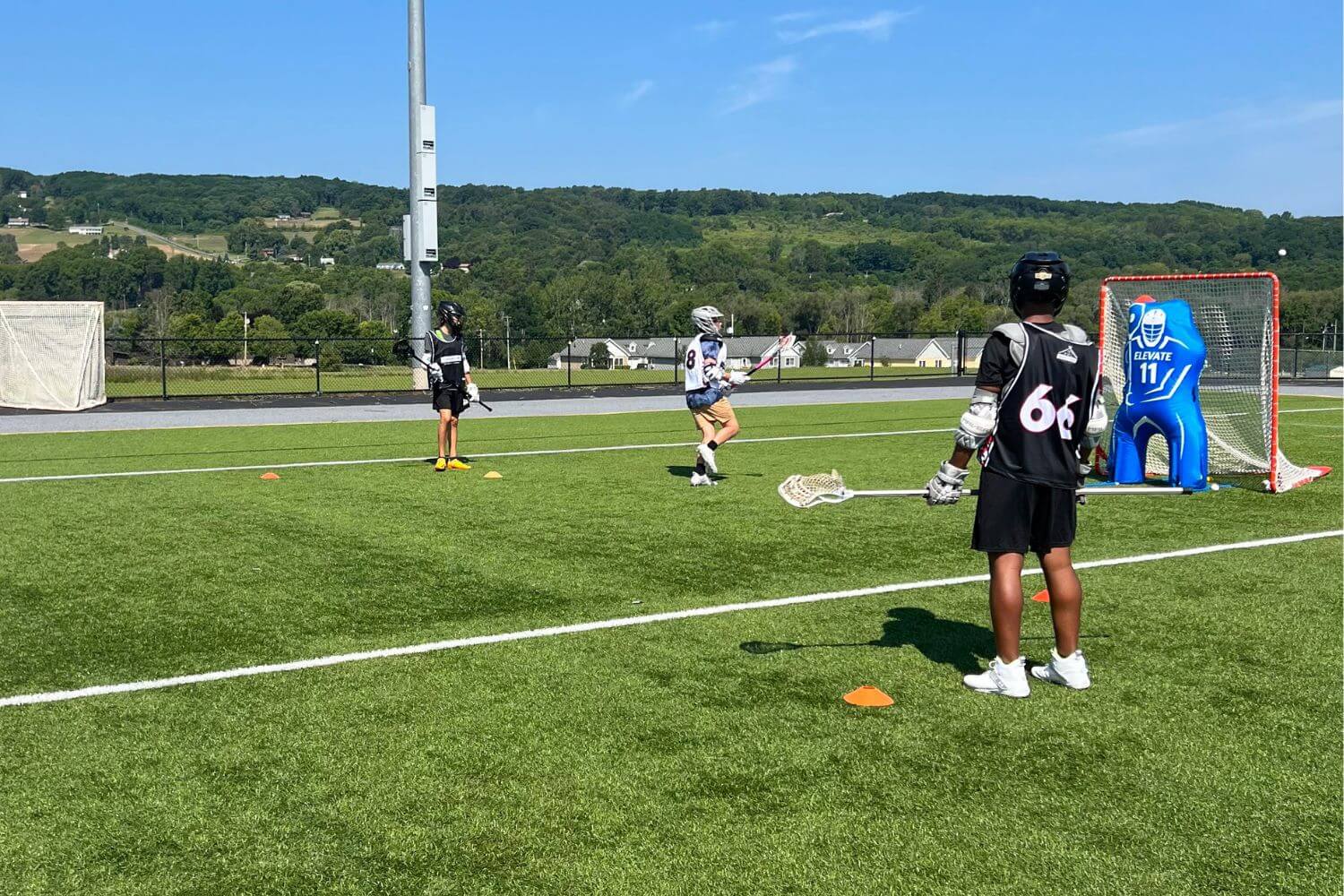 Boys lacrosse practice at summer camp