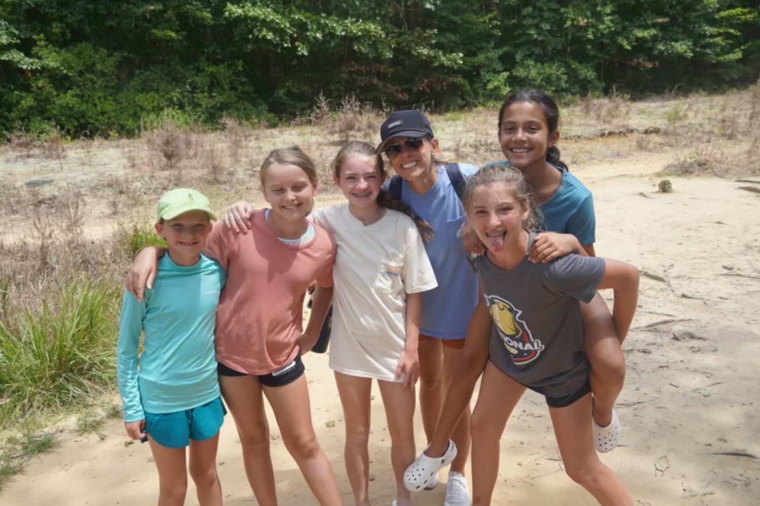 A group of girls and a summer camp counselor during a TN hike