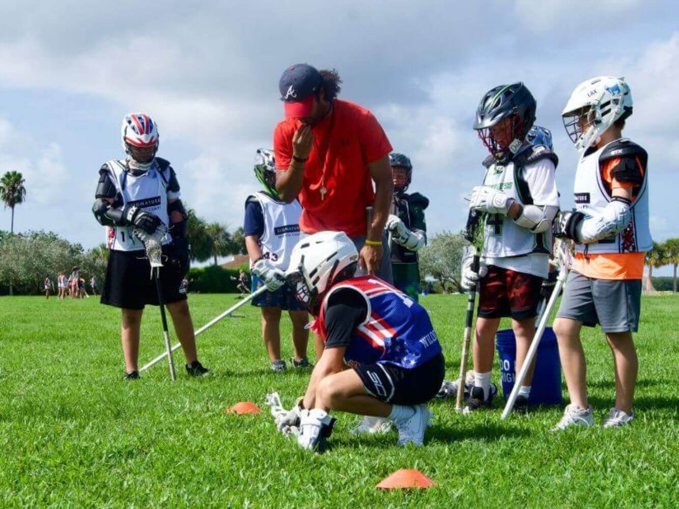 Lacrosse player practicing a face off drill during summer lacrosse camp