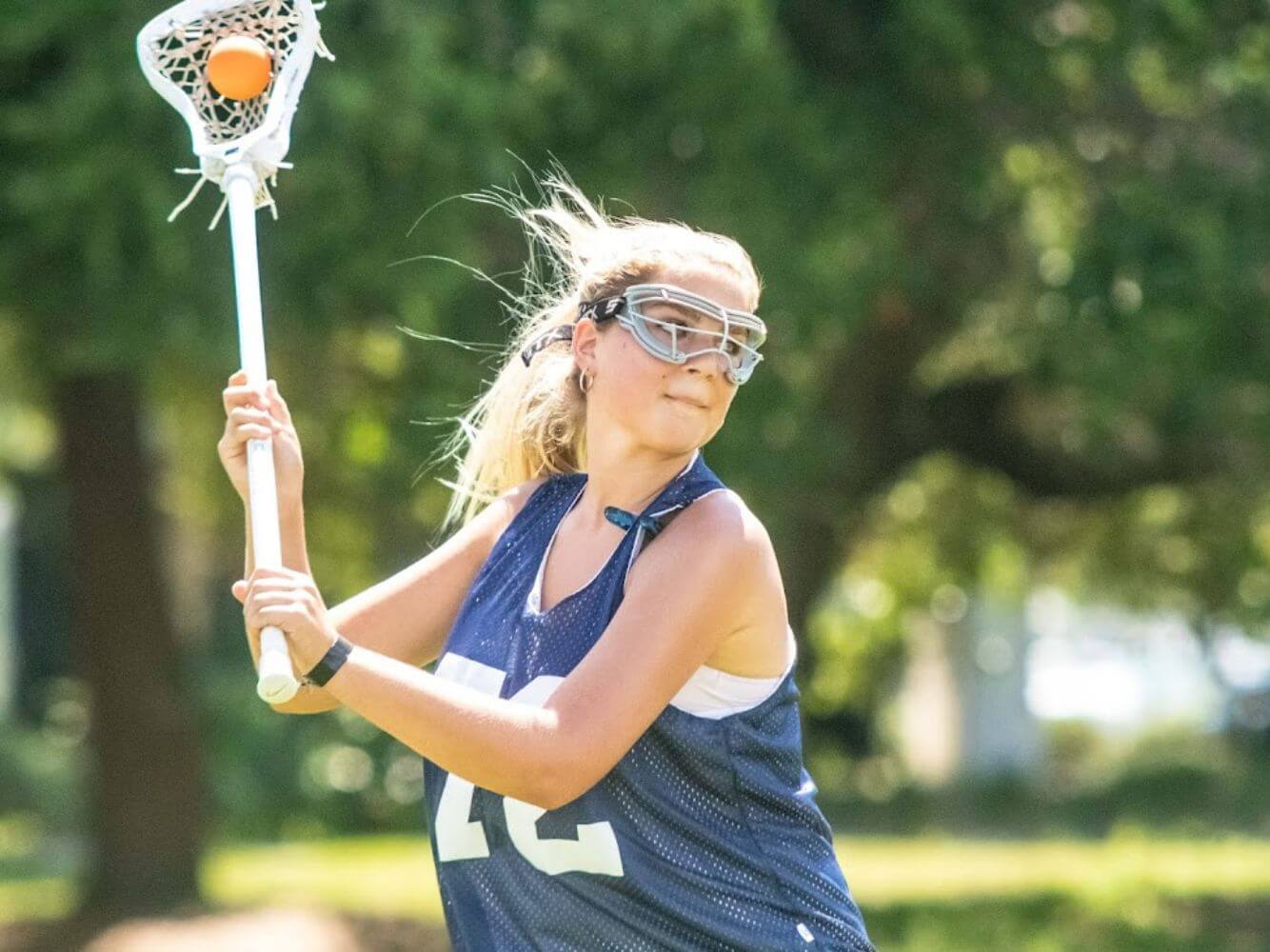 Lacrosse player practicing the Attacker position during a scrimmage at summer camp