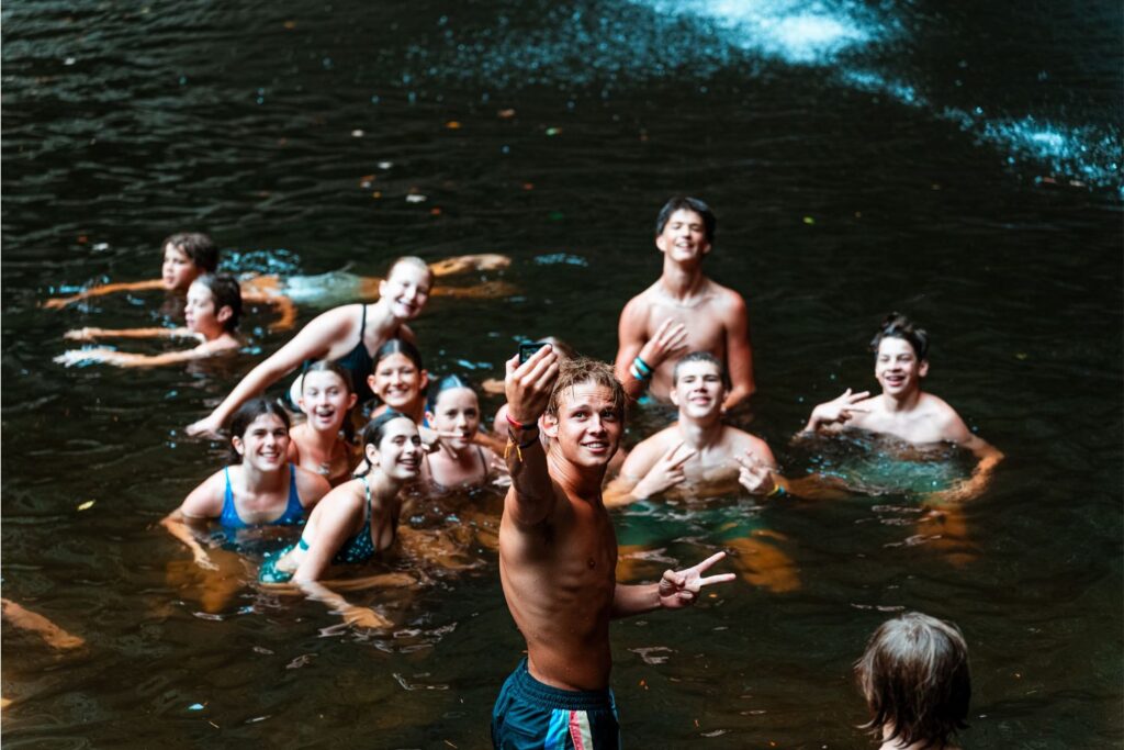 Group photo of campers at the swimming hole