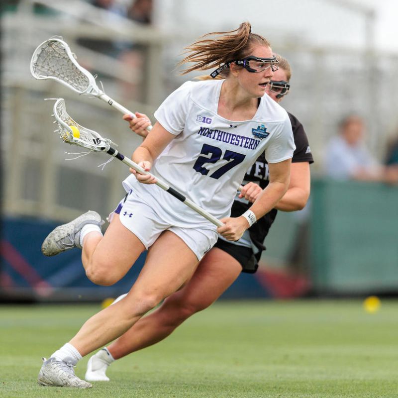 Professional lacrosse player Izzy Scane playing during a match for Northwestern University