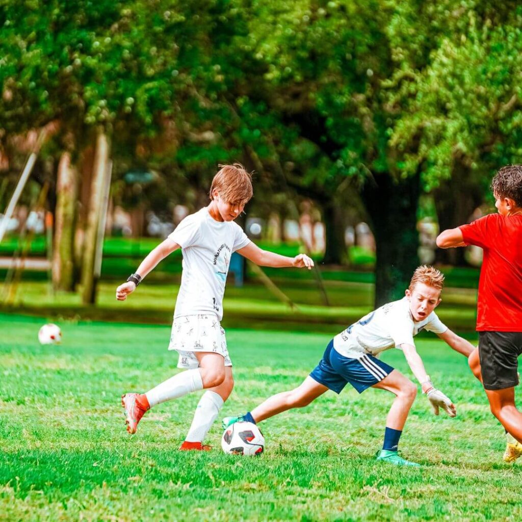 Boys at summer soccer camp during a practice scrimmage