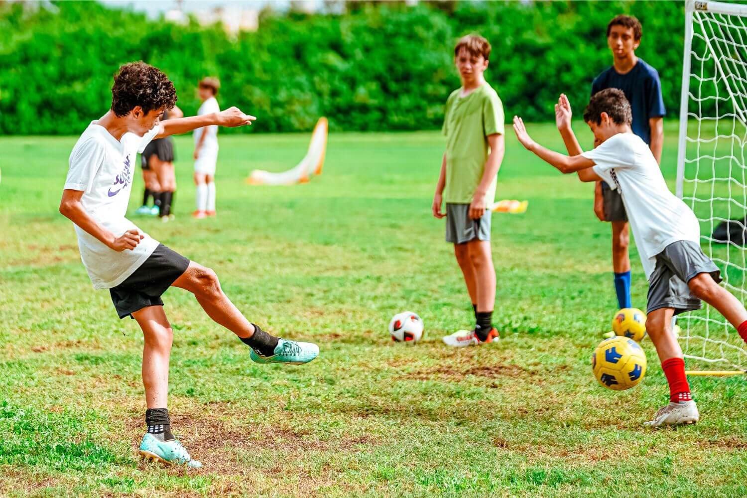 Boys in action during soccer practice