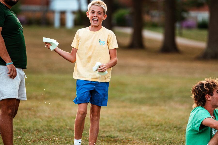 Boy holding a sponge during Medicine Man game