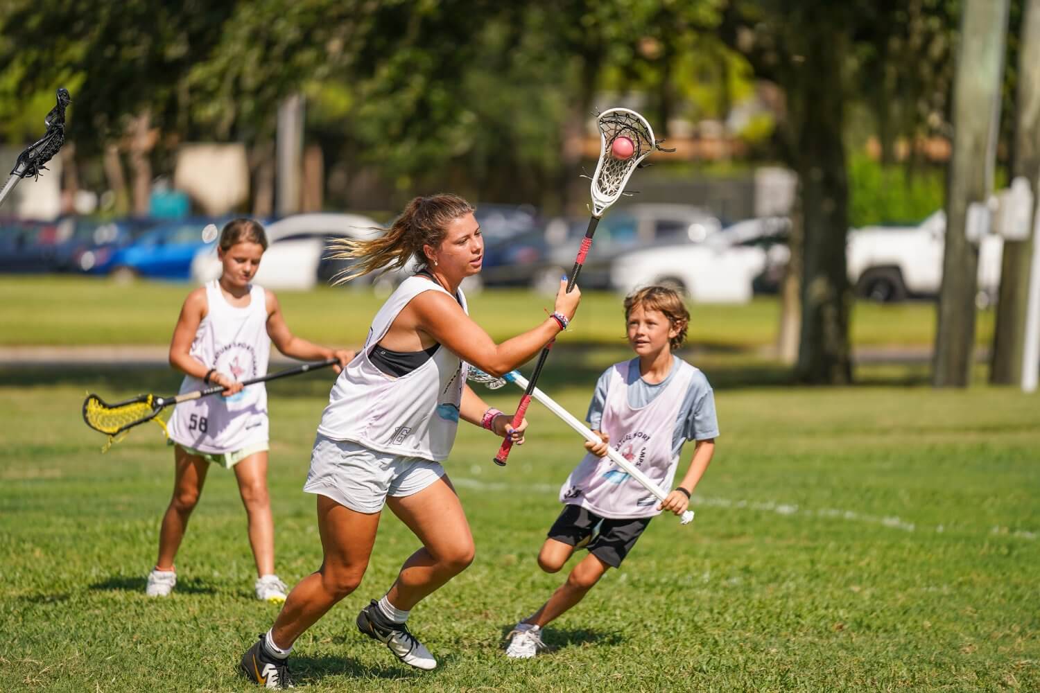 Lacrosse players at camp during a scrimmage