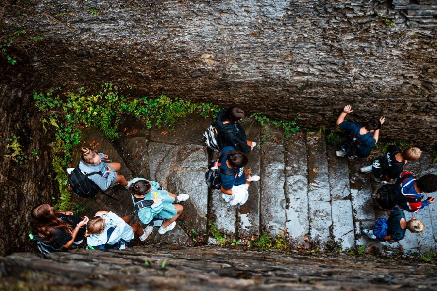 Kids hiking Foster Falls during signature sports camp