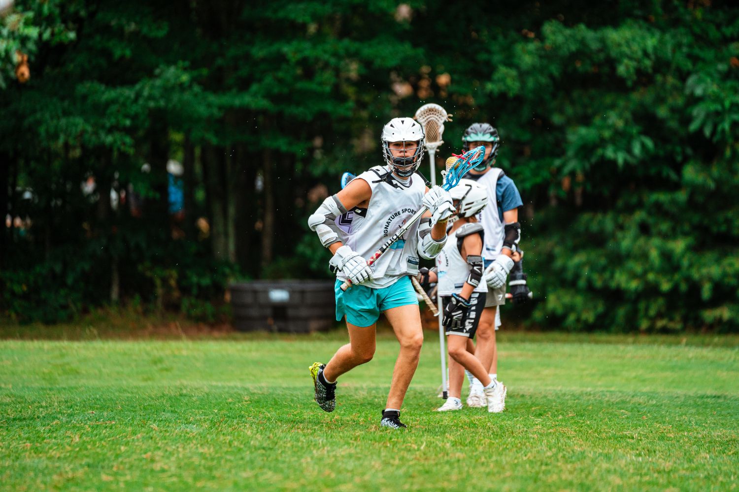 lacrosse players geared up on the field