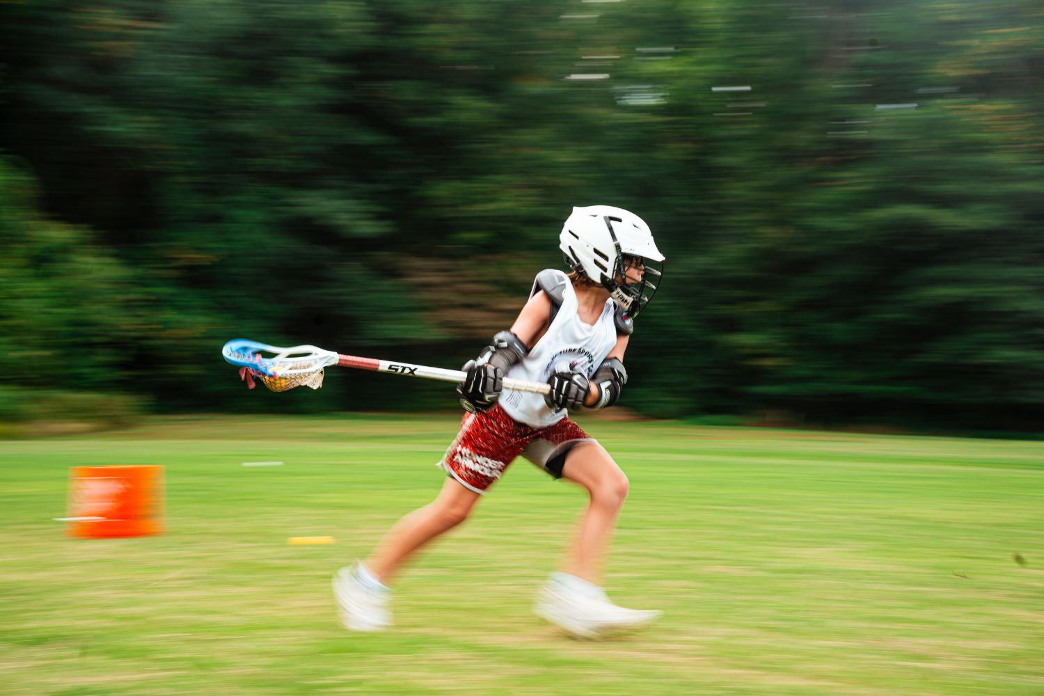 Action shot of a lacrosse player during practice