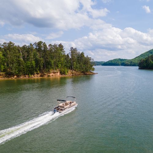 Aerial view of a pontoon boat on a lake