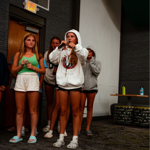 Three girls at sports camp presenting their invention during Sports Shark Tank