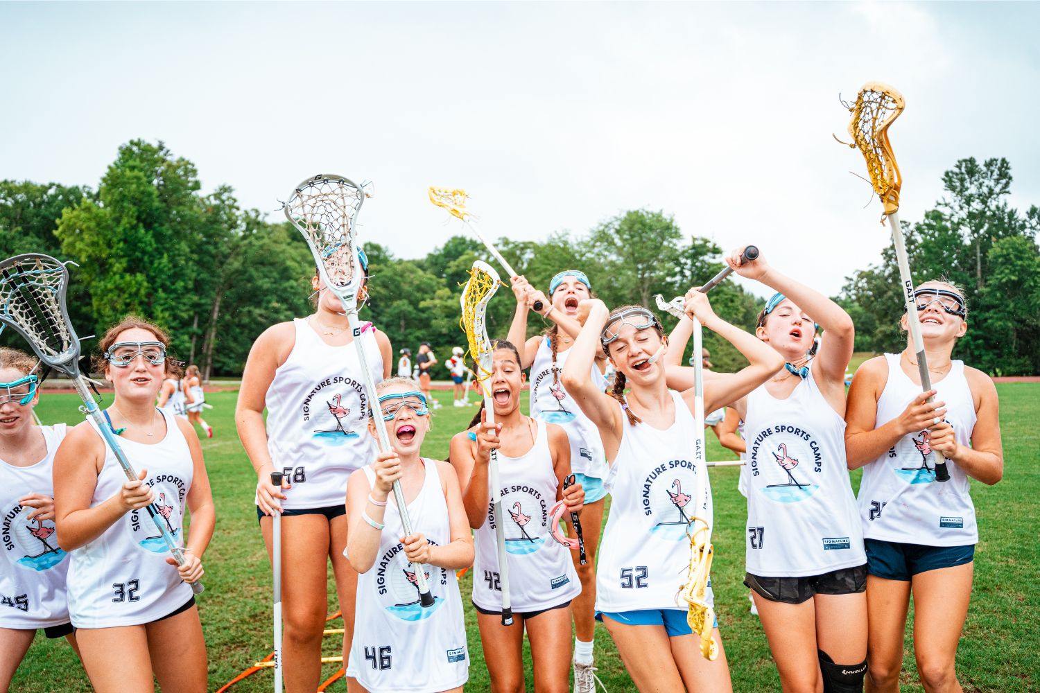 Girls group silly photo on the lacrosse field