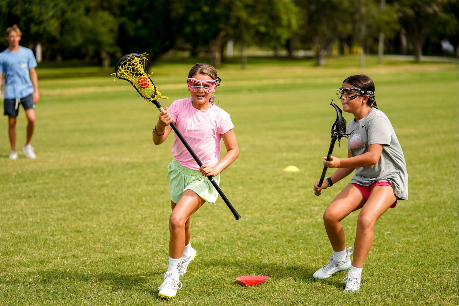 Girls at lacrosse camp doing drills during practice