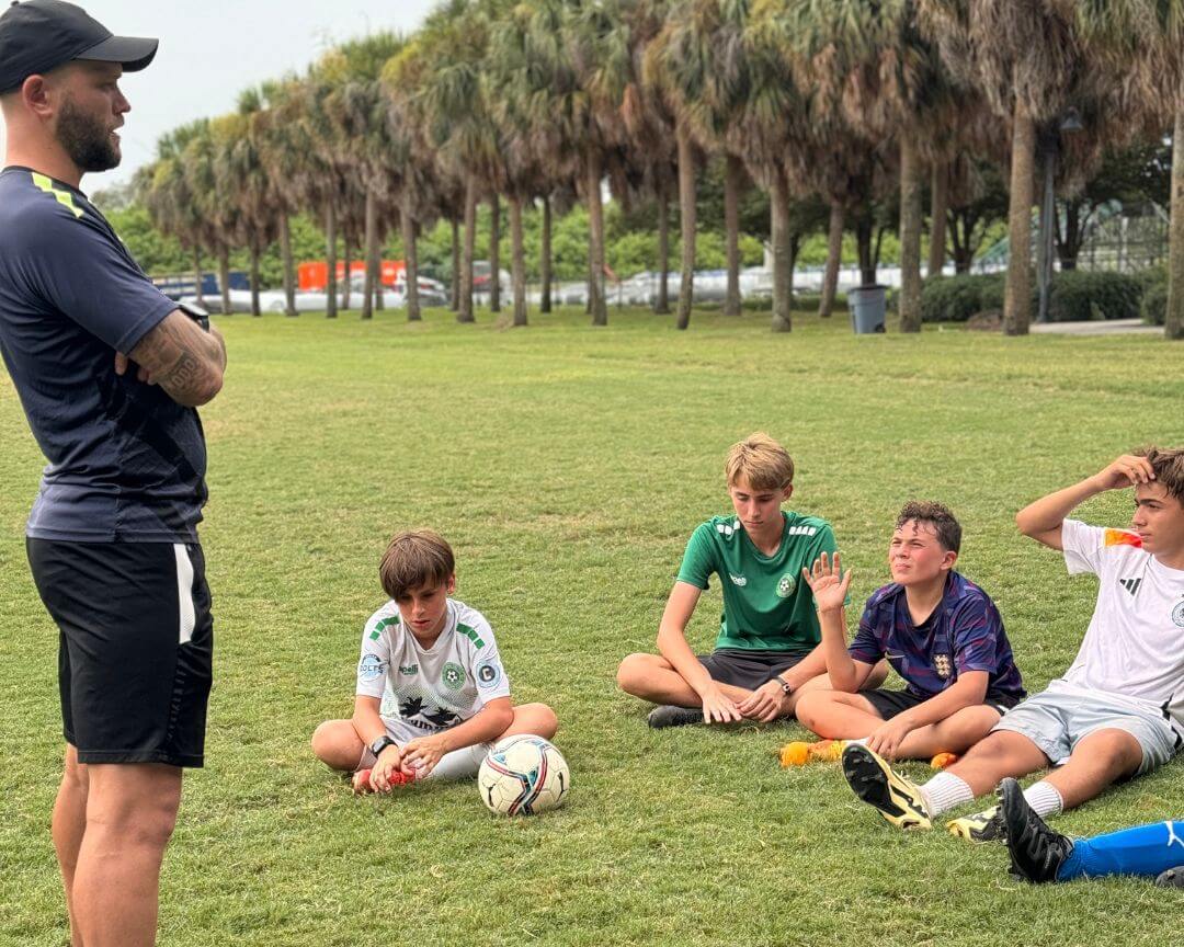 Pro soccer player Nicky Law answering kids questions at signature sports camps