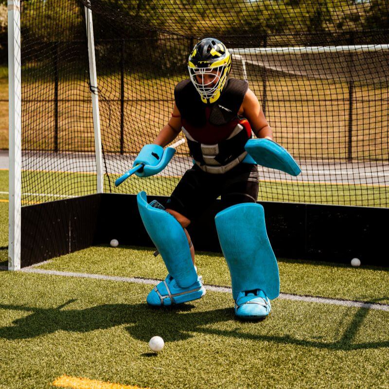 Field hockey goalie during practice at signature sports camp