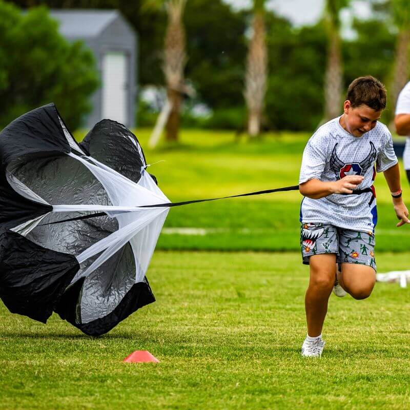 Boy at signature sports camp during strength and conditioning drills for field hockey