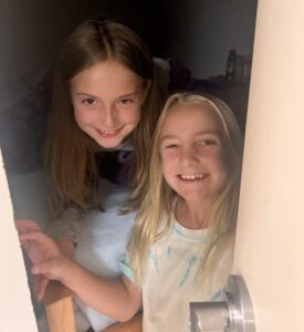 Two youth lacrosse players bunking together at overnight lacrosse camp.