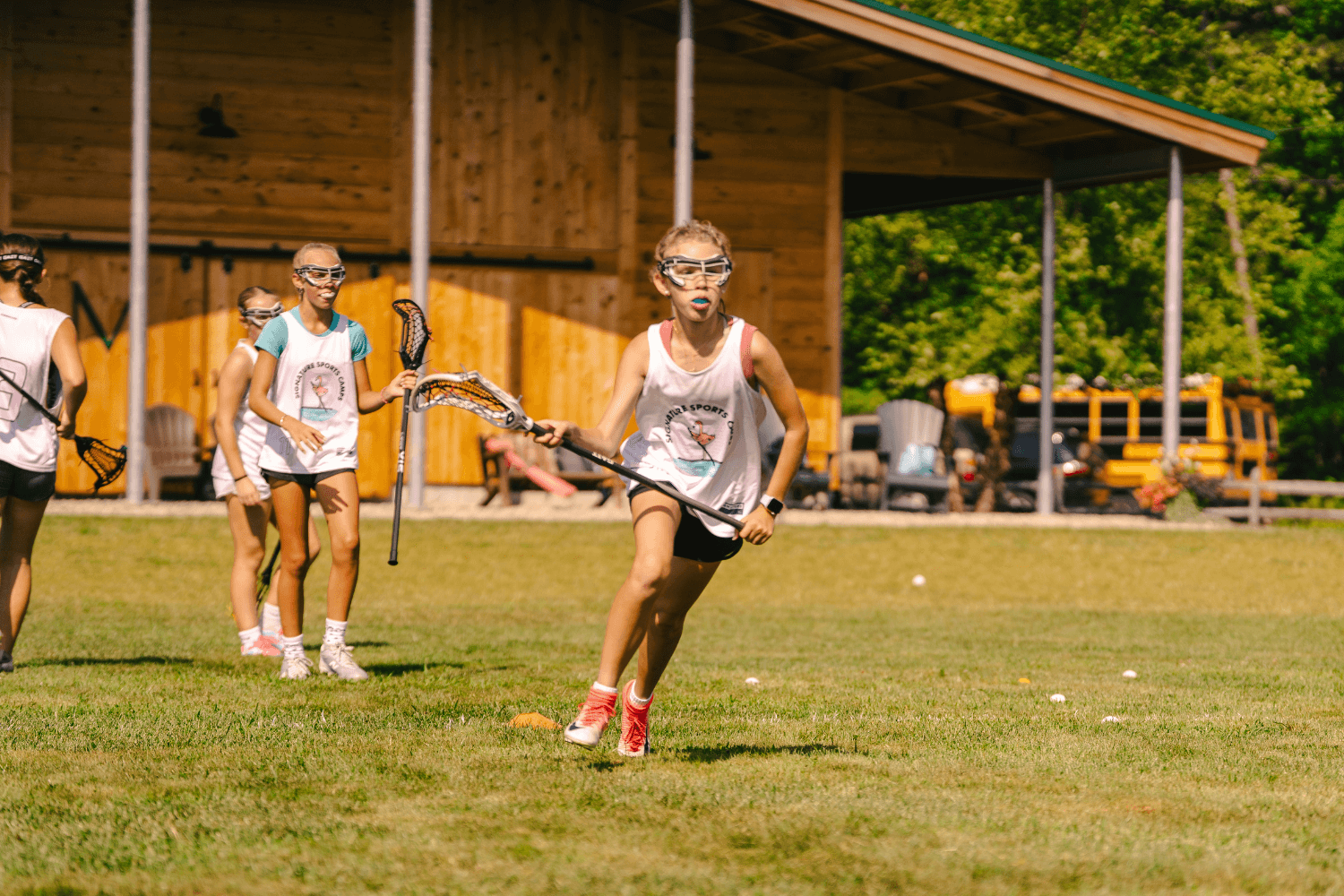 Girls during lacrosse practice at overnight sports camp