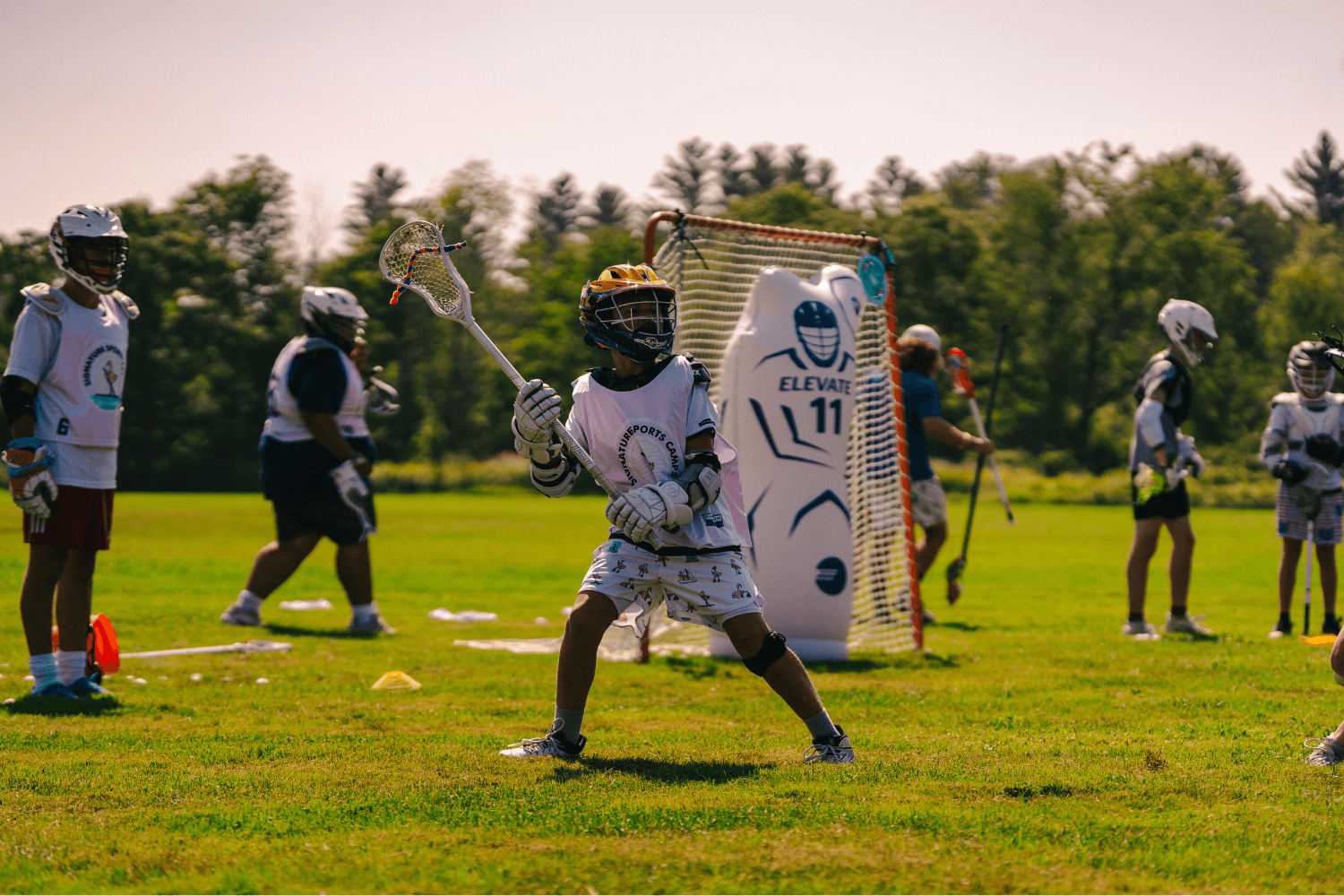 Boys during lacrosse practice at overnight sports camp