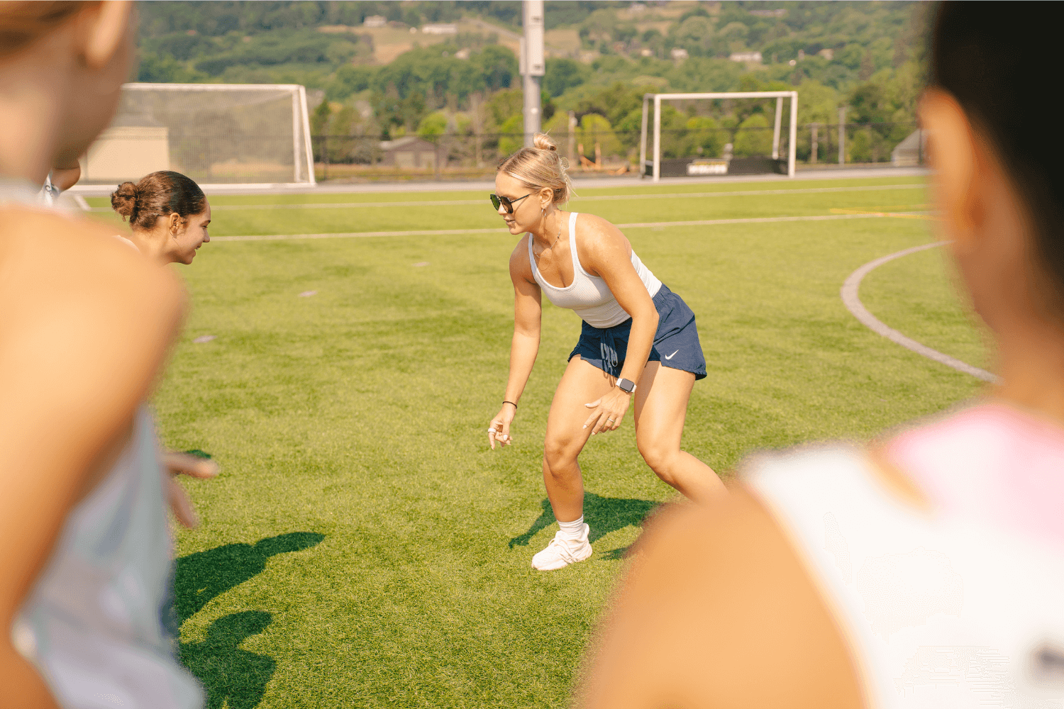 Field hockey pro giving a lesson during overnight sports camp