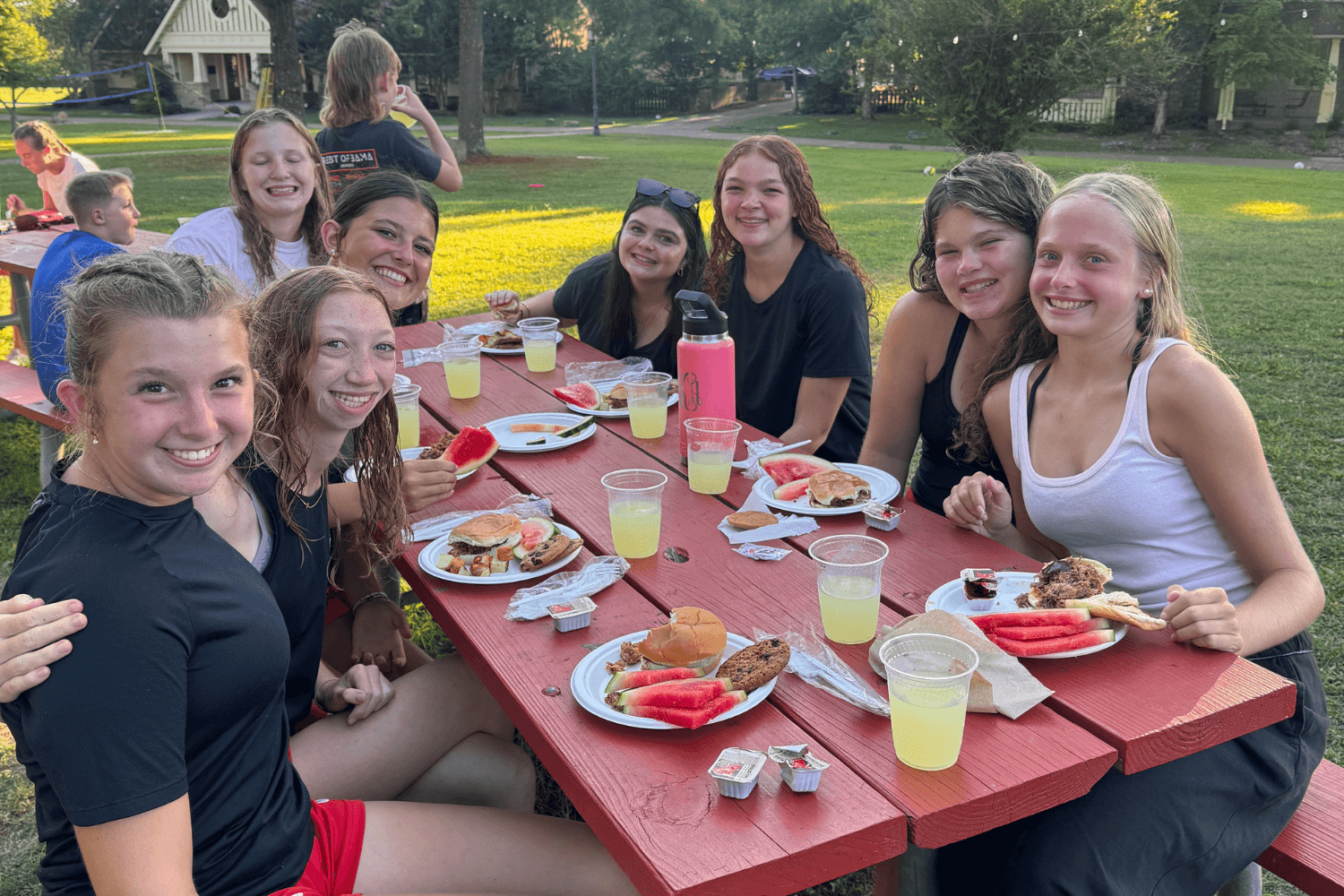 Girls eating dinner together at overnight sports camp in Tennessee