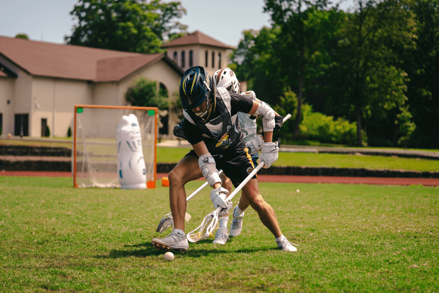 Boys during lacrosse scrimmage at overnight sports camp