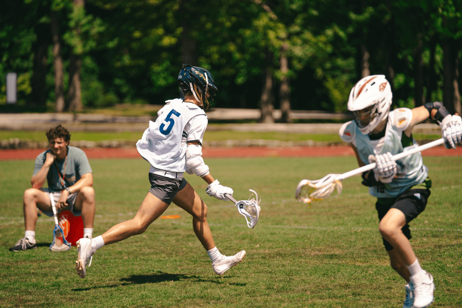 Boys during lacrosse practice at overnight sports camp