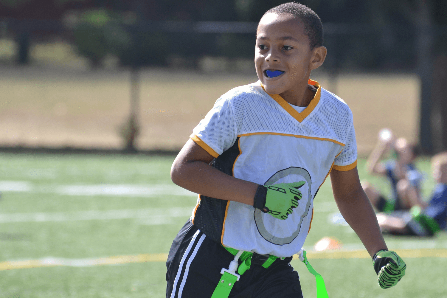 Boy playing flag football