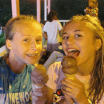 two girls eating ice cream cones at overnight sports camp