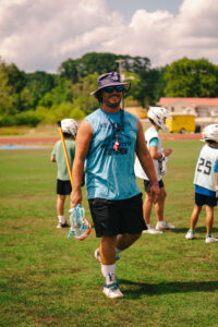 Great Youth Sports Coach ready to lead drills on the field.