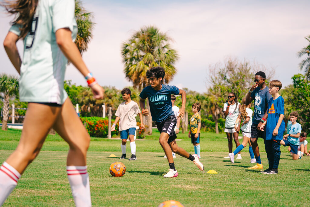 Kid playing soccer at camp