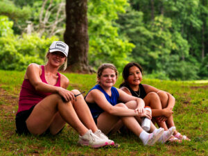 Coach with campers at overnight sports camp.
