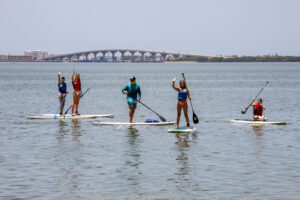 Florida Campers paddle boarding in the Bay.